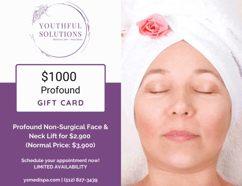 A woman with her eyes closed and head wrapped in a towel.