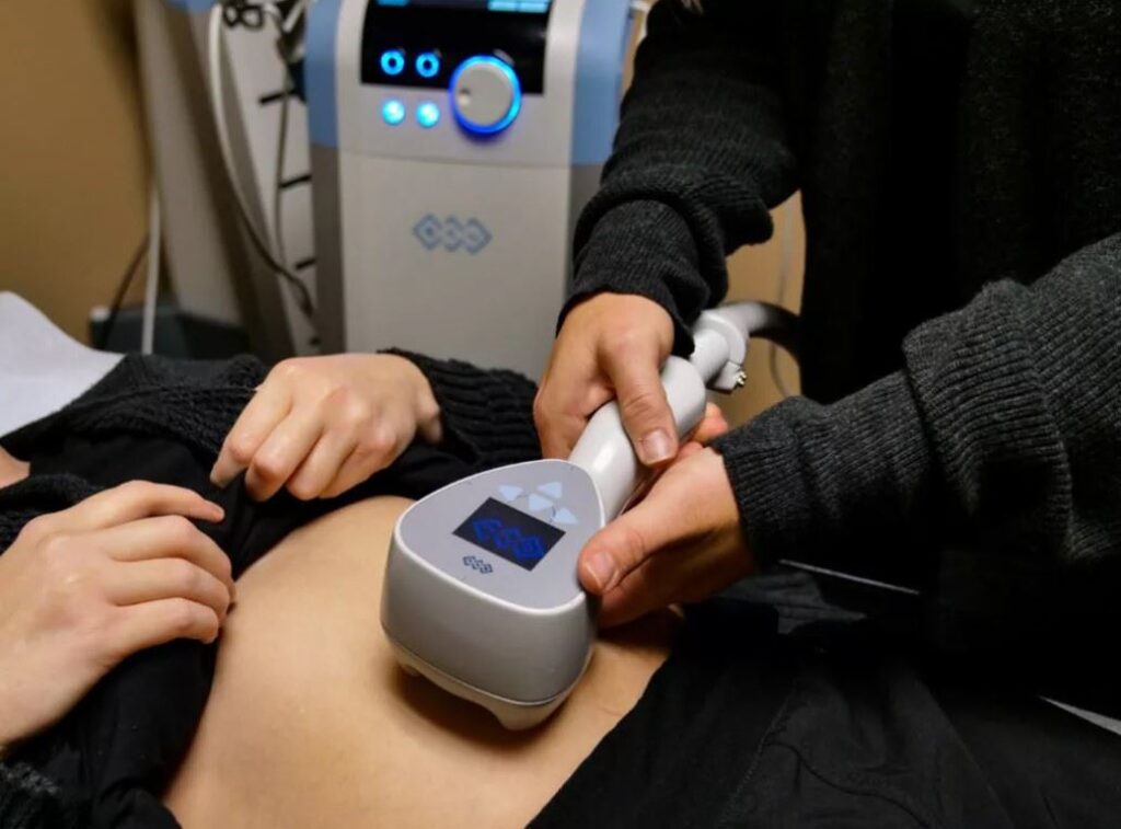 A person is getting their belly button examined.