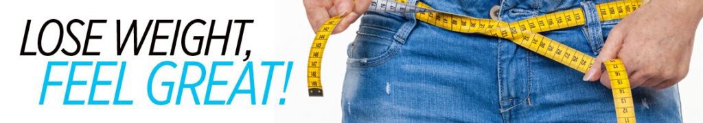 A person is holding a measuring tape around their waist.